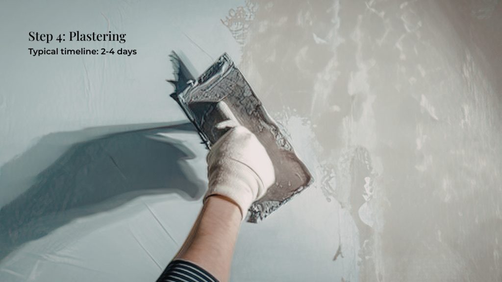 plasterer working in kitchen